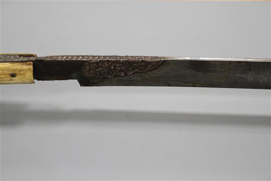 A Turkish sword Yataghan, with silver inlaid decoration and inscription, ivory grips, overall length 72cm